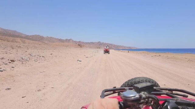 Driving a quad bike in the desert near Dahab, Egypt