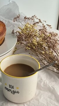Fresh homemade cake served with a cup of coffee, perfect for breakfast or an afternoon snack. Warm, comforting and inviting homemade food concept.