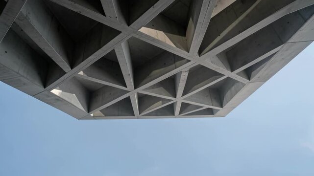 Geometric Facade Underside Against Bright Sky.