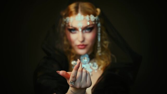 Fantasy dark queen woman beauty face waving hands finger beckoning inviting follow me to Victorian masquerade ball stylized themed party, luxury elf girl, black dress hood blonde hair royal person 