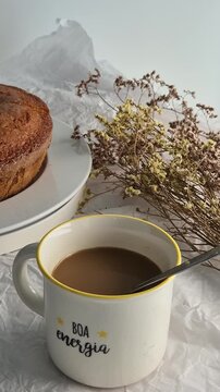 Fresh homemade cake served with a cup of coffee, perfect for breakfast or an afternoon snack. Warm, comforting and inviting homemade food concept.