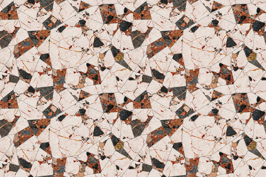 Geometric mosaic pattern made of broken marble tiles in shades of beige, brown, and black with visible cracks and stone texture surface