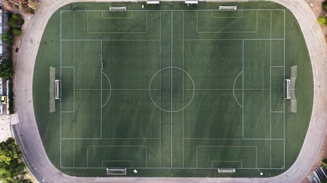 Aerial drone view of two empty soccer fields sports infrastructure and community recreation concept top-down shot
