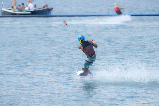 Man Wakeboarding On Hot Summer Day