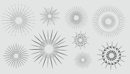 Obraz premium Set of nine vintage sunburst and starburst vector graphics with radiating lines, isolated on light grey.