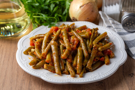 Traditional Turkish zeytinyagli taze borulce green black eyed peas stew on white plate