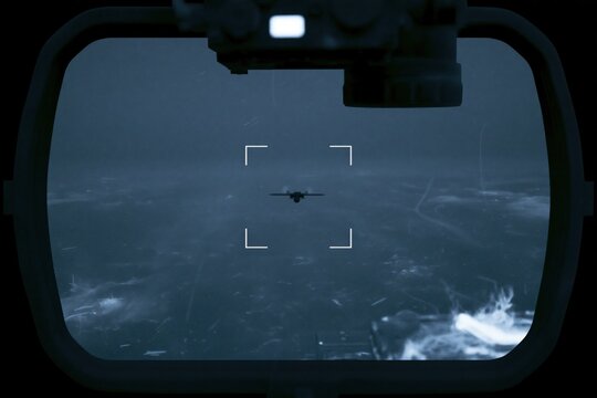 EO IR surveillance system tracking small military reconnaissance UAV over open sea during long range maritime security monitoring
