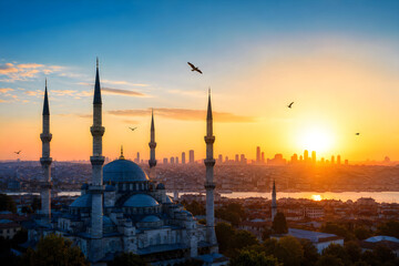 Naklejka premium Beautiful Mosque with Minarets at Golden Sunset Sky Islamic Architecture