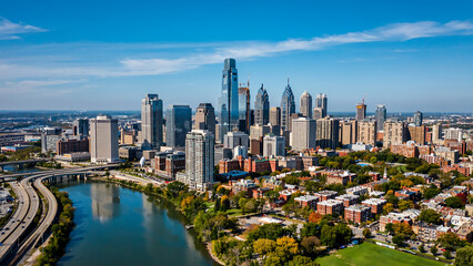 Fototapeta premium Panoramic aerial view of city skyline featuring river and urban development