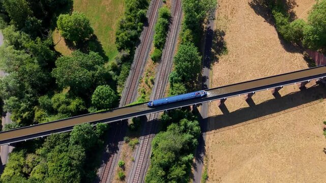 Aerial view of canal narrowboat navigating the historic Edstone Aqueduct in Warwickshire