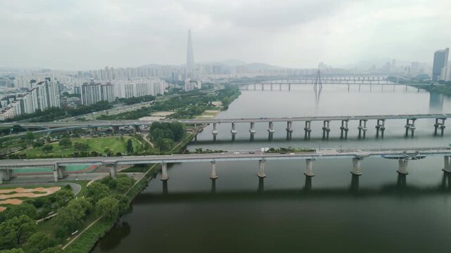 4K Drone of Hangang River by Gwangnaru Hangang Park and Gwangjin Bridge on a Cloudy Day
