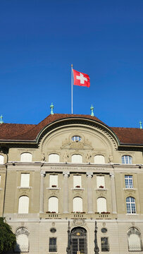 Main facade of the Swiss National Bank headquarters building with Swiss flag on June 23, 2026 in Bern, Switzerland.	