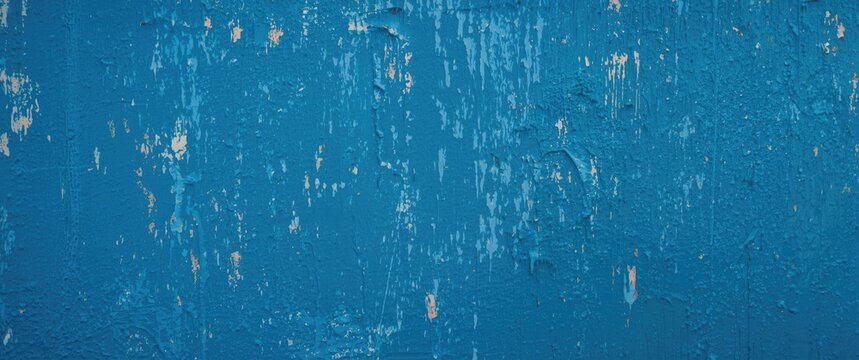 Textured Blue Wall Surface with Flaking Paint in Natural Light