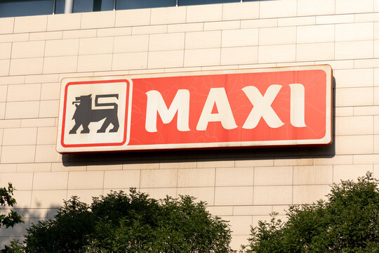 Maxi supermarket illuminated sign, retail chain owned by Delhaize