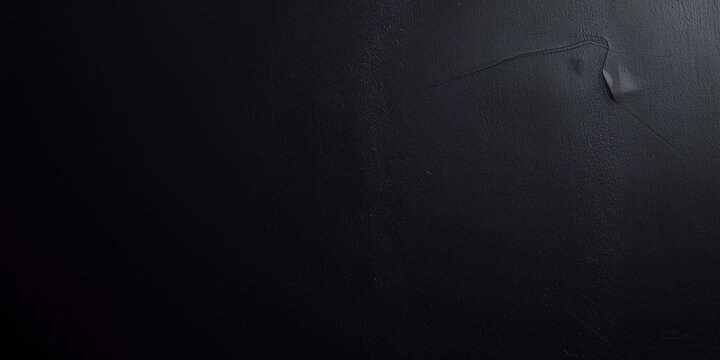 Black Textured Surface with Subtle Dimples and Scratches