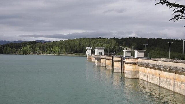 Hydroelectric Power Plant Infrastructure: Industrial Concrete Dam and Scenic Water Reservoir Architecture in Mountain Landscape