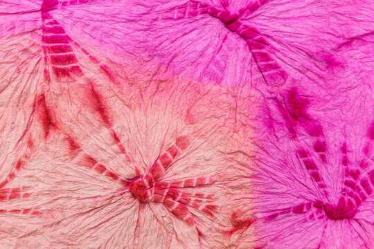 Pink paper texture background, blank wrinkle pink paper with tie dye design pattern background