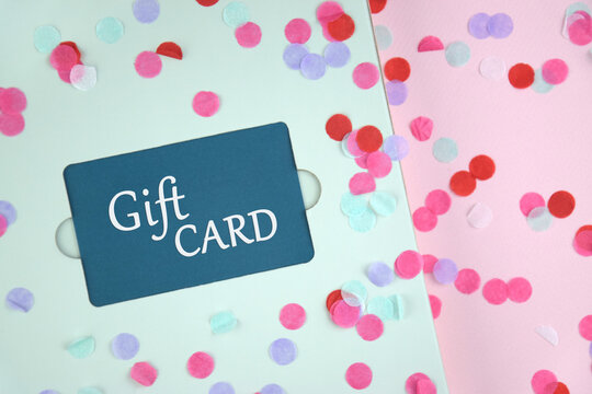 Blue Gift Card with flowers on a light background