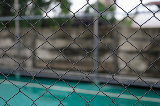 Metal Chain Link Wire Mesh Fence Facing Outdoor Green Court