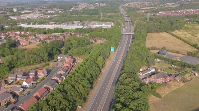 A forward aerial drone view of the M54 motorway in Shropshire, UK