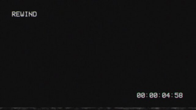 Vintage vhs rewind screen with timecode and noise overlay