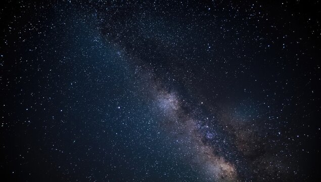 Milky Way galaxy illuminated in a dark starry sky