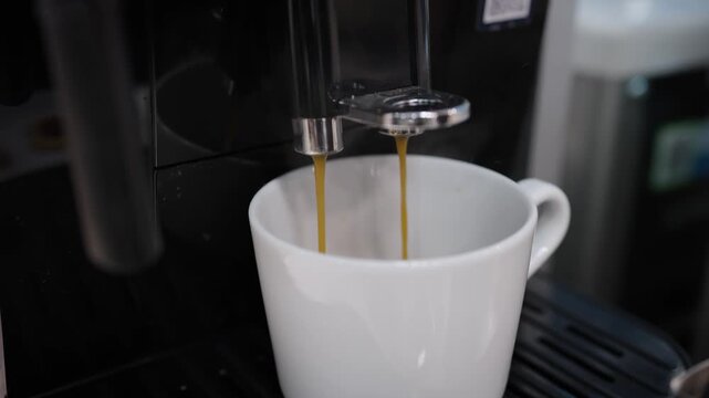 Automatic coffee machine pouring espresso drink