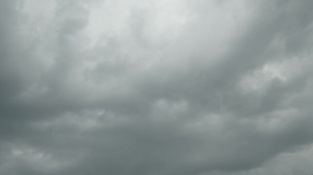 Dark overcast sky filled with heavy grey storm clouds before rain.