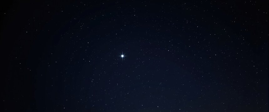 Bright Star Illuminating the Night Sky Amidst Twinkling Stars