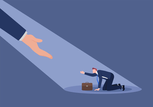 The businessperson received help from a hand accompanied by light.