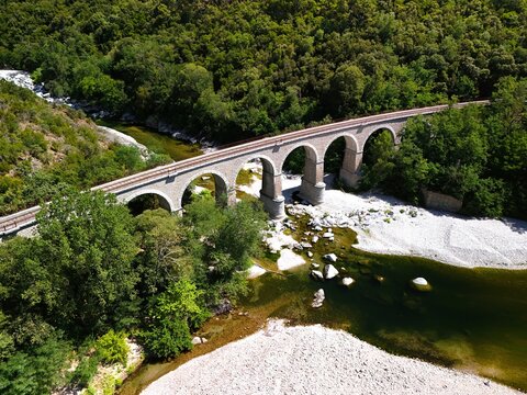 Aerial View of Historic Railway Bridge Crossing the Gardon River in Anduze, France