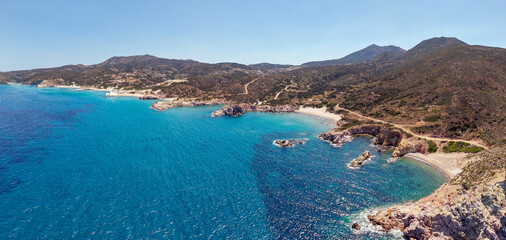 Fototapeta premium Panoramic aerial view of Ammoudaraki and Triades beaches, Milos island, Greece