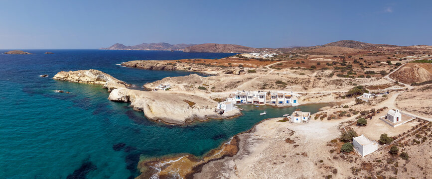 Panoramic aerial view of Agios Konstantinos fishing village with syrmata, Milos island, Greece
