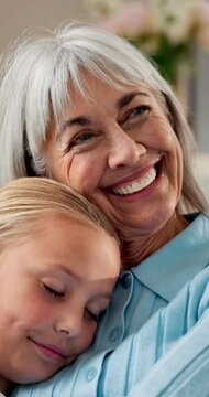 Smile, grandmother and child at house with hug, love and parental care for bonding together. Happy, senior woman and embrace in home with kid, affection and family connection for babysitting weekend