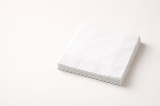 Stack of White Napkins on a Light Background
