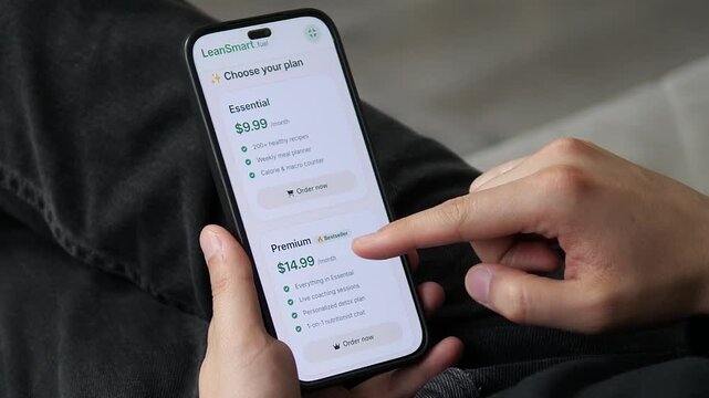 User comparing the Essential (9.99 dollars) and Premium (14.99 dollars) plans side-by-side. The visual hierarchy highlights the value of the upgrade. Ideal for pricing page design, subscription models
