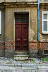 Old door to a tenement house in the Old Town of Poznań, Poland. © Bernhard