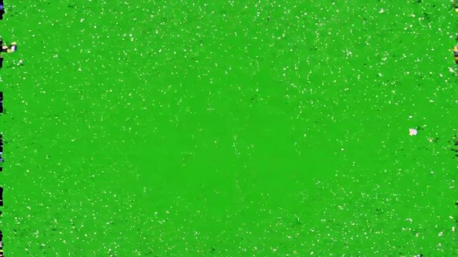 Digital glitch distortion effects and pixelated noise patterns flickering over a bright green screen background for video editing overlay