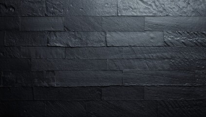 Textured Black Slate Wall Surface in Dim Lighting © vxnaghiyev