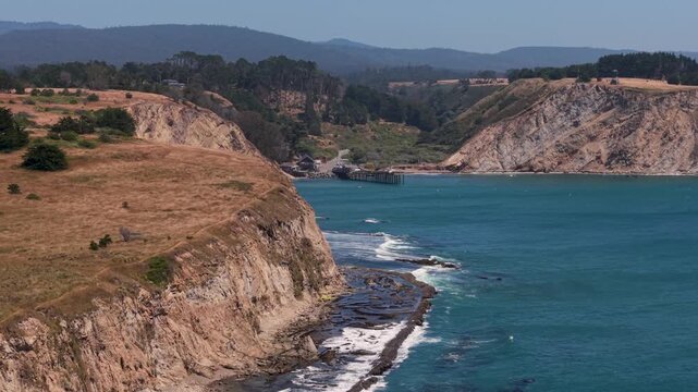 Watch the aerial views of the Point Arena Fishing Pier and cliffs near the lighthouse south of Mendocino on the northern coast.