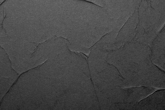 Black paper abstract background with folds, mockup
