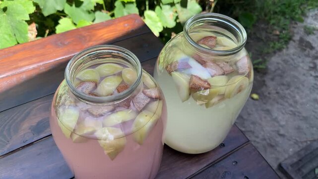 Homemade kvass and apple bread cider in jars. High quality 4k footage