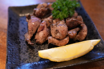 Close-up of Charcoal Grilled Chicken Skin Yakitori with Savory Sauce