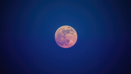 Full Moon Glowing in a Dark Blue Night Sky © vxnaghiyev