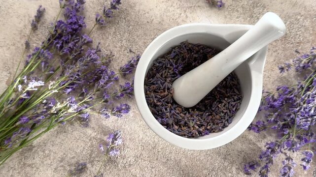 Preparing dried lavender flowers in mortar