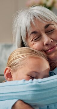 Happy, grandmother and child at house with hug, love and parental care for bonding together. Smile, senior woman or embrace in lounge with kid, affection and family connection for babysitting weekend
