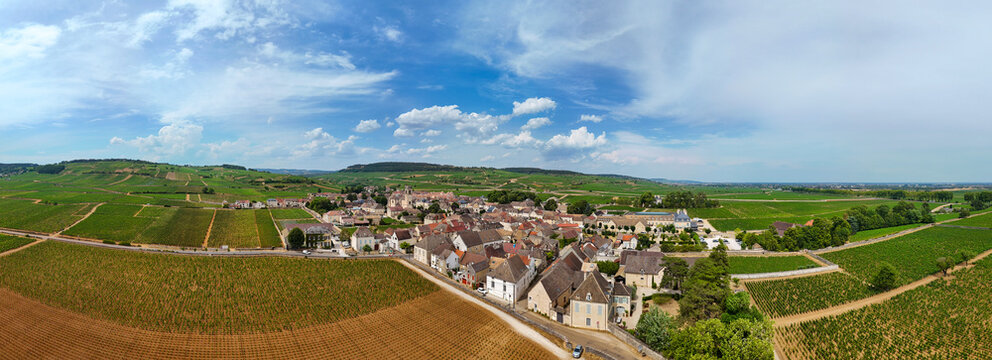 Panoramic aerial view of Pommard, Burgundy, France, featuring Pinot Noir vineyards, viticulture, wine production, agriculture, and the historic village landscape.