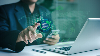 Fototapeta premium esg net zero sustainability carbon reduction renewable energy.Business professional managing Net Zero strategy with digital analytics to monitor carbon reduction and ESG performance.