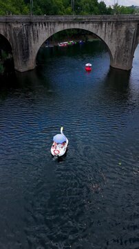 Establishing Shot of Catamarans on River Tamega, Amarante, Portugal