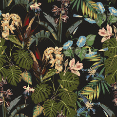 Seamless pattern with tropical palm leaves and exotic plants. Dark and bright palm leaves on the dark background. Vector seamless pattern. Tropical illustration. Jungle foliage. © Iuliia